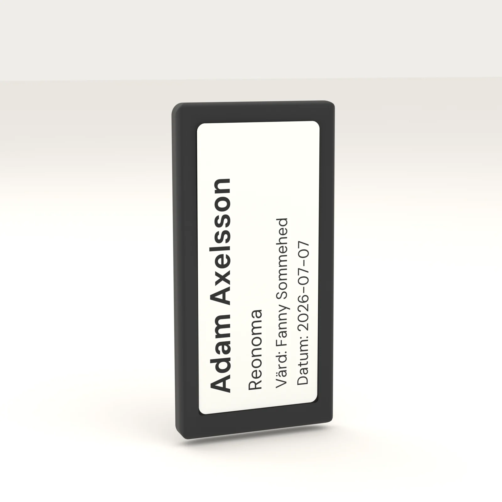 A single Reonoma e-ink visitor badge